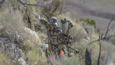 man hunting in camo hat and clothing