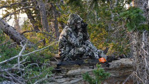 man hunting in camo rain gear